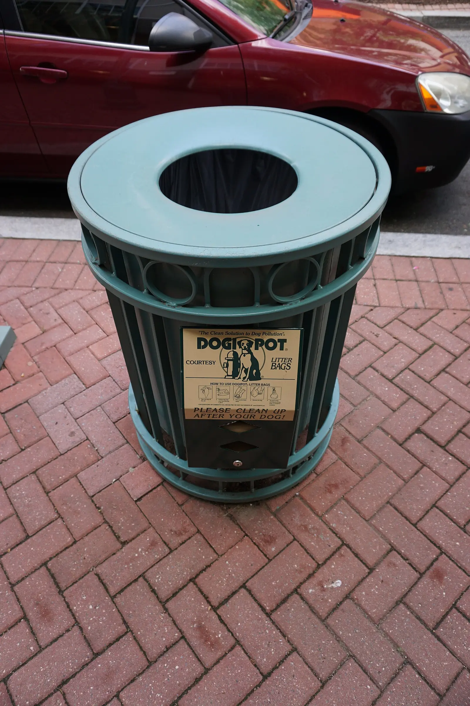 A pet waste bag dispenser on a trash can on Campbell Avenue in the Village at Shirlington.