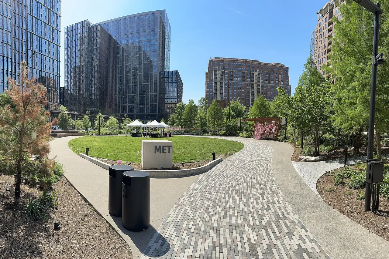 The lawn and paths of Metropolitan Park in National Landing, where Howl-ween and MoCA's family art days are held.
