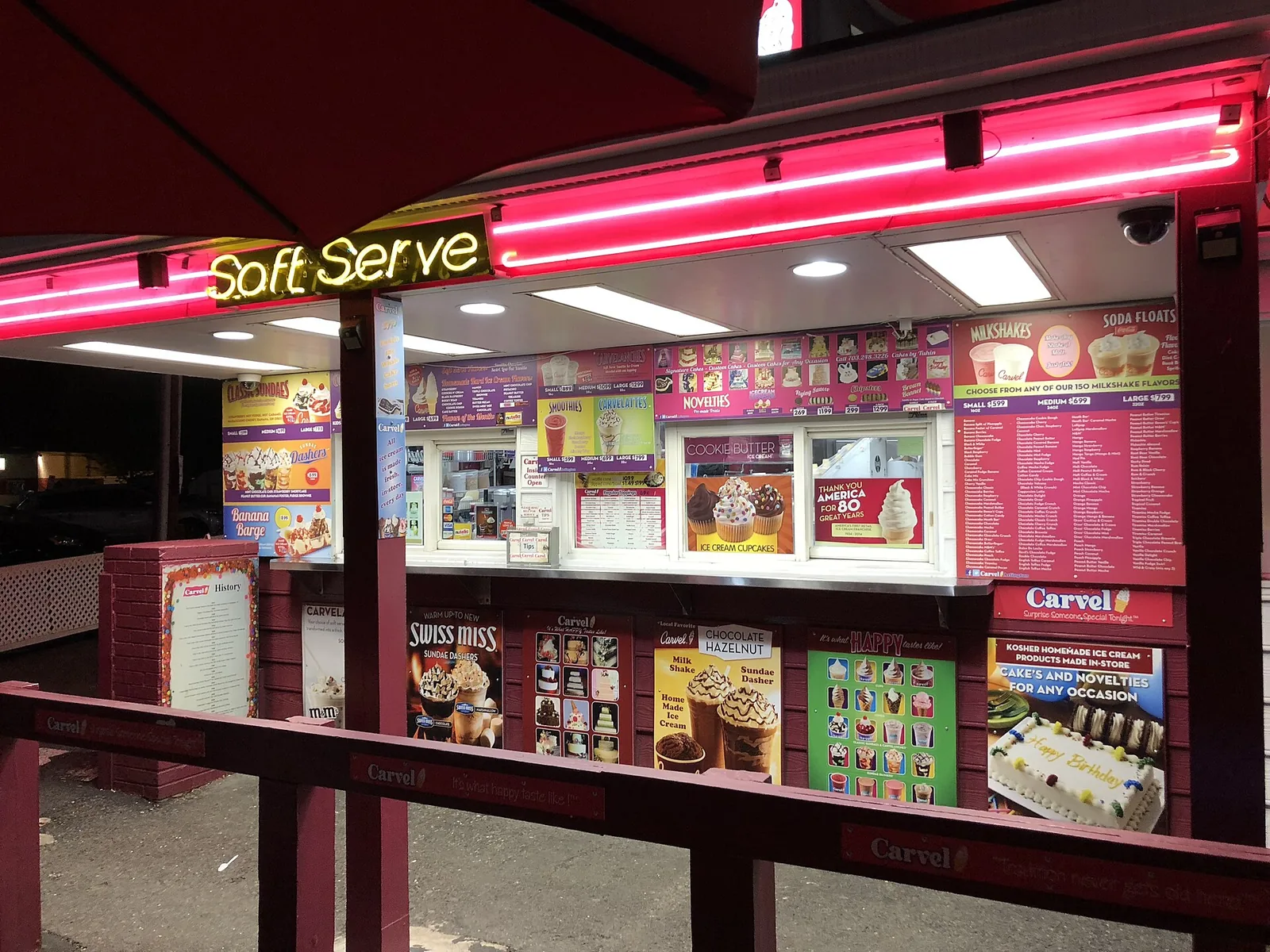 The Carvel soft-serve window at Mario's Pizza House on Wilson Boulevard in Clarendon, lit at night.