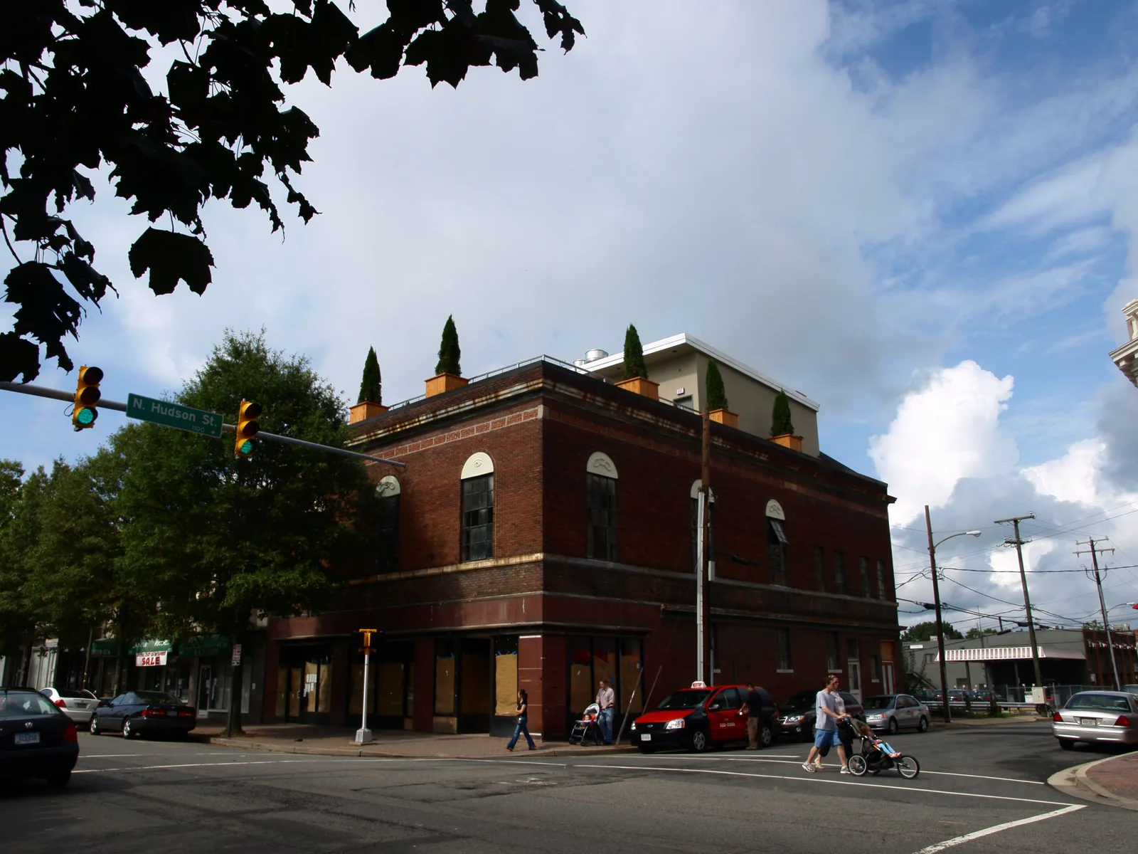A two-story brick commercial building on a corner at North Hudson Street in Clarendon, Arlington.