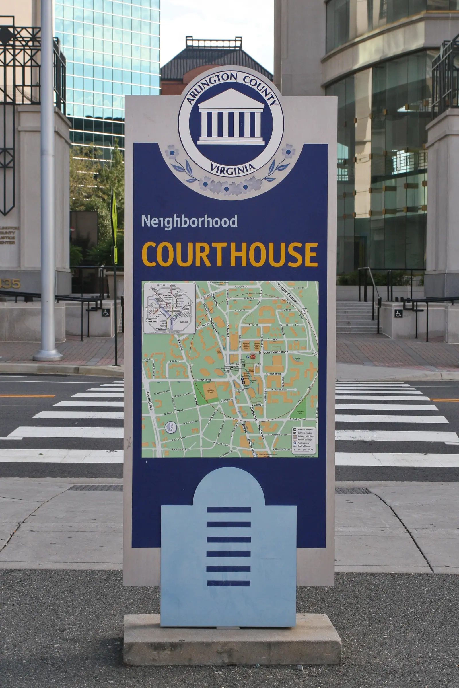 An Arlington County neighborhood sign and map for Courthouse, in front of the Arlington County Justice Center.