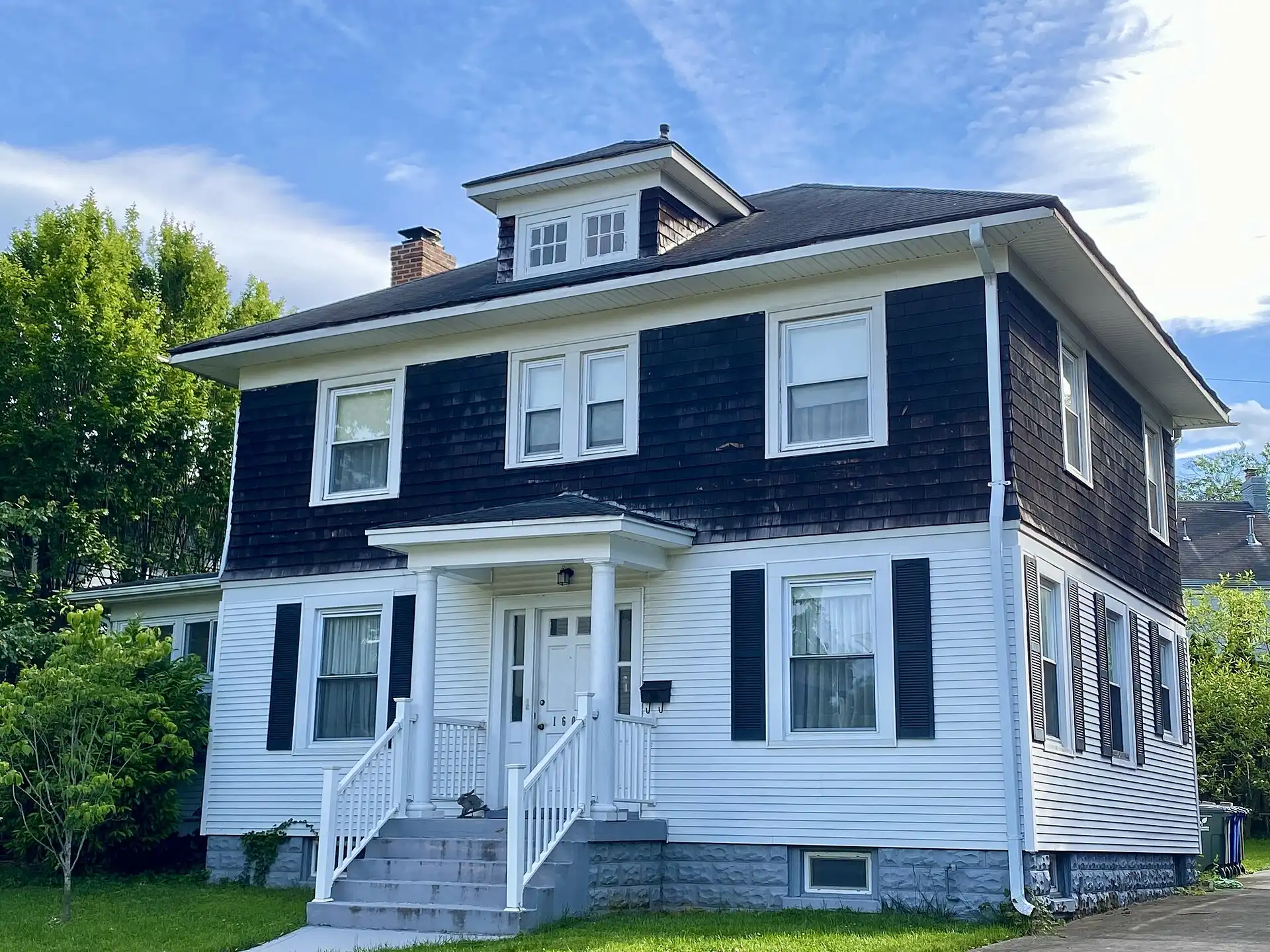 An American foursquare house in Lyon Village, inside the Innovation Elementary attendance zone.