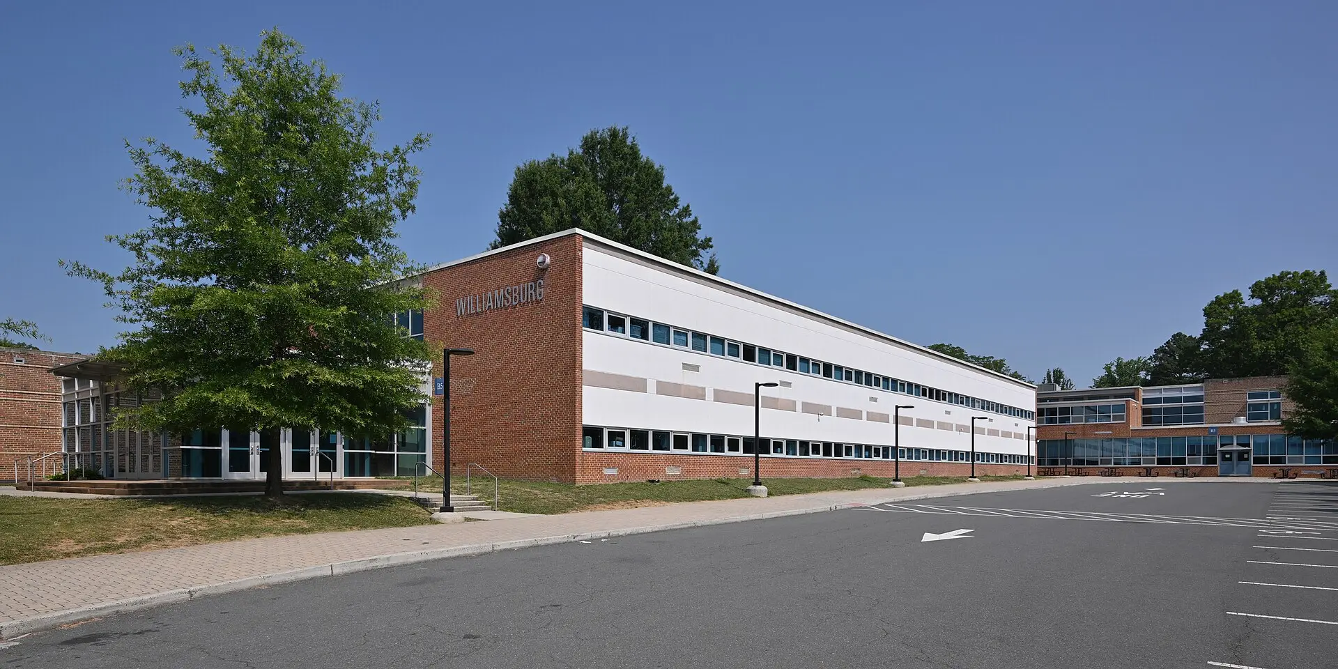The side of the Williamsburg Middle School building and part of its parking lot on North Harrison Street in Arlington.