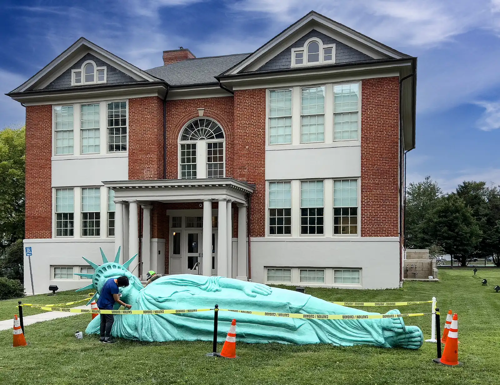 Zaq Landsberg's Reclining Liberty sculpture on the lawn of MoCA Arlington on Wilson Boulevard, where the Día de los Muertos picnic is held.
